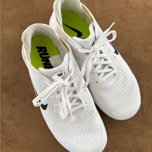 White Nike Running Shoes with Black Accents